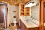 Lower level full bath with walk in shower and adjoining sauna